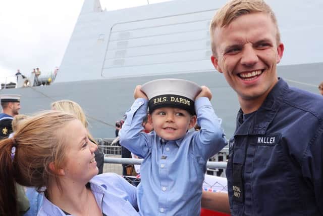 Archie Lancashire, 5, with mother Abbie-Leigh Waller and uncle Able Seaman (Seaman Specialist) Callum Waller. Picture by LPhot Gy Pool.