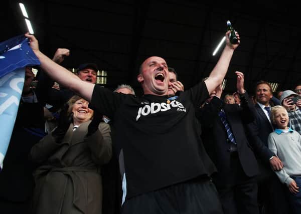Paul Cook celebrates Pompey's League Two triumph Picture: Joe Pepler