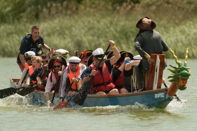 Portsmouth City councillors paddle to victory as the Nelson's Heroes team. Picture: Keith Woodland