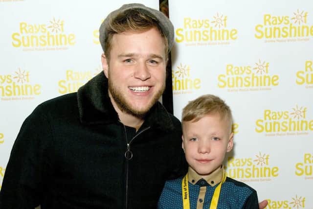 Olly Murs meeting eight-year-old Harry Holden at the Royal Albert Hall. Harry has complex illnesses. ENGPPP00120140702110517