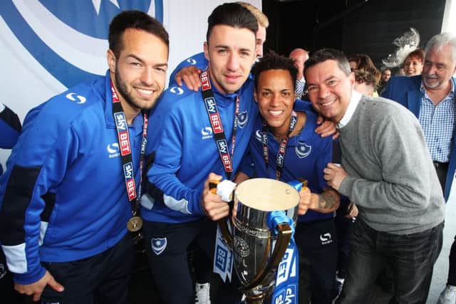 Milan Lalkovic, Enda Stevens, Kyle Bennett and Mark Catlin with the League Two title. Picture: Joe Pepler