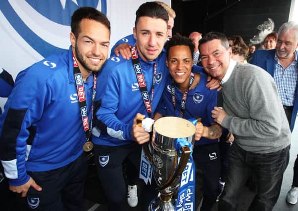 Milan Lalkovic, Enda Stevens, Kyle Bennett and Mark Catlin with the League Two title. Picture: Joe Pepler