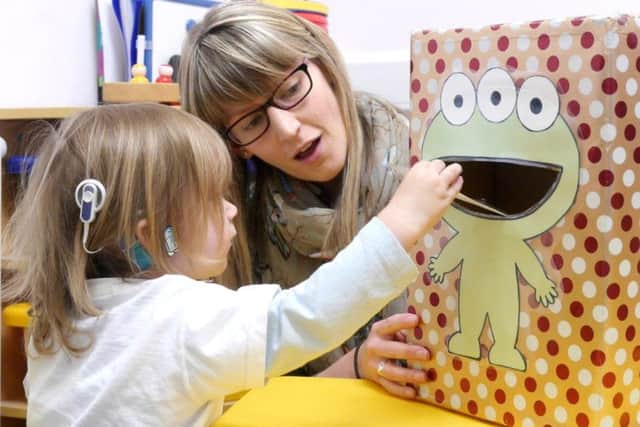 Harley Duggan, two, with speech and language therapist Charlotte Emery