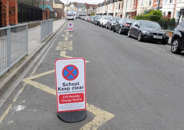 The new parking penalty signs outside Wimborne Junior School in Portsmouth 

Picture: Sarah Standing (170401-4342)