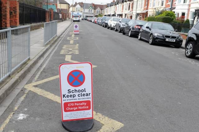 The new parking penalty signs outside Wimborne Junior School in Portsmouth
Picture: Sarah Standing (170401-4342)