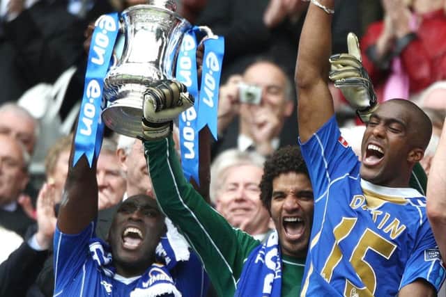 Captain Sol Campbell went up to lift the FA Cup for Pompey