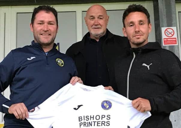 Matt Tubbs, right, is welcomed to the Hawks by manager Lee Bradbury and chairman Derek Pope
