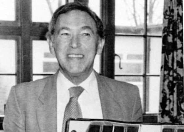 Fred Francis with an early edition of Scalextric which he invented.