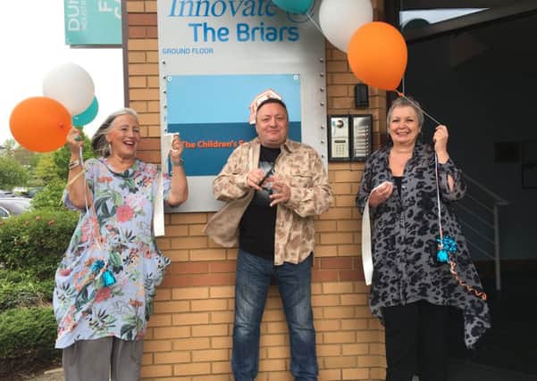 From left Marina Mulholland, chief executive of The Children's Family Trust, Steve Power from radio station Wave 105, and Karen Blackman, manager of The Children's Family Trust, at the unveiling of the foster charity's new office in Waterlooville
. Picture: Tamara Siddiqui