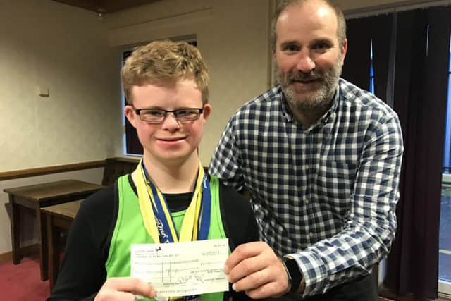 Max Ross receives the cheque from Kiernan Easton