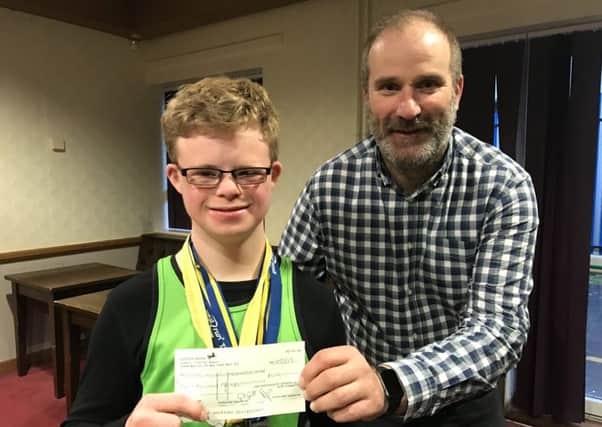 Max Ross receives the cheque from Kiernan Easton