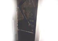 The damage to the front door of Absolute Running, in Southsea.