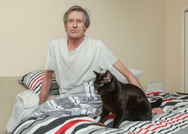 Jack Lovelock, 58, back at home reunited with Charlie the Cat.

Picture: Habibur Rahman (170646-23)