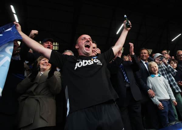 Paul Cook celebrates Pompey's League Two title win. Picture: Joe Pepler