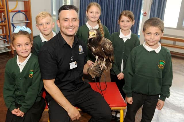 Jason Ashcroft from Falconry UK with an Egyptian vulture and, from left, Dollie Smith, Fletcher McInnes, Amber Brown, Taylor Todd and Liam Shiers. Inset. Picture: Sarah Standing (170661-2260) PPP-170519-155836001