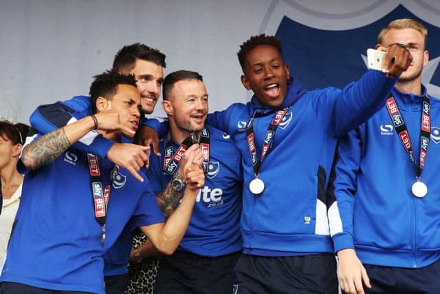 Jamal Lowe takes a selfie with his Pompey team-mates during the celebrations on Southsea Common. Picture: Joe Pepler