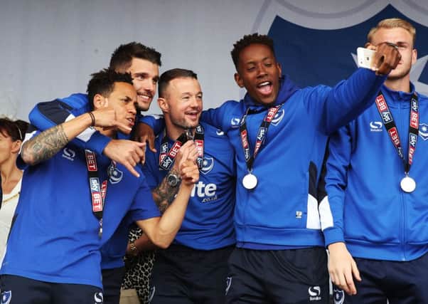 Jamal Lowe takes a selfie with his Pompey team-mates during the celebrations on Southsea Common. Picture: Joe Pepler