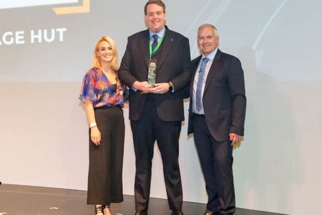 Chris Schutrups (centre) of The Mortgage Hut is presented with his award by presenter of The Gadget Show, Georgie Barat (left) and MAB Sales Director Gareth Herbert