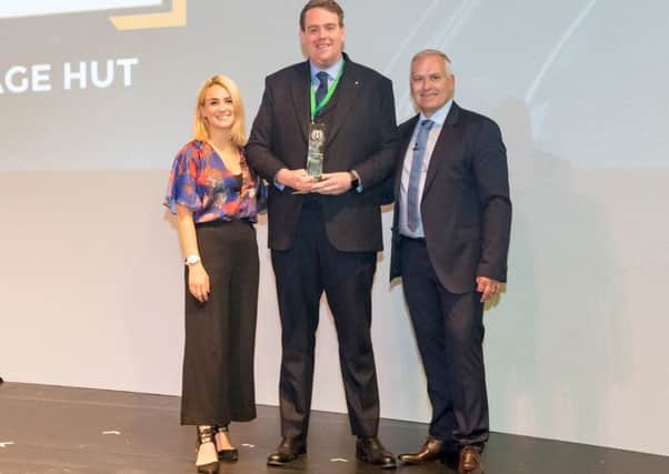 Chris Schutrups (centre) of The Mortgage Hut is presented with his award by presenter of The Gadget Show, Georgie Barat (left) and MAB Sales Director Gareth Herbert
