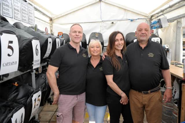 Neil Matthews, landlord of the Delme Arms, at last 2016's festival with wife Angie, sister-in-law Lorraine Young, and Kev Sims.