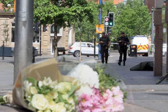 Flowers left close to the Manchester Arena, the morning after a suicide bomber killed 22 people, including children, as an explosion tore through fans leaving a pop concert in Manchester