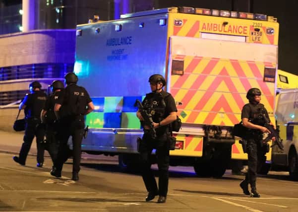 Armed police at Manchester Arena after the explosion at the venue during an Ariana Grande gig. Picture: Peter Byrne/PA