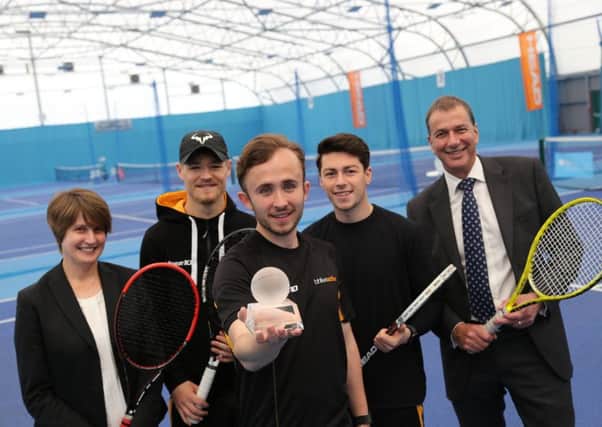 John Taylor, front holding the trophy, with Jo Dallas Portsmouth Tennis Centre manager, Dan Jolliffe, Macca Neaves and Peter Gunn BH Lives chief executive.