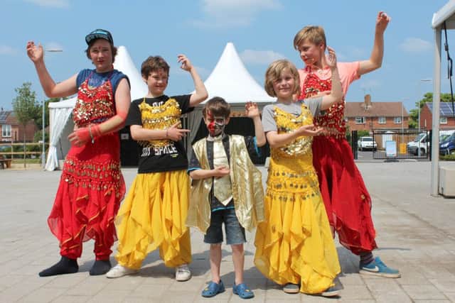 Youngsters enjoying dressing up at Picnic in the Park 2016, at Park Community School