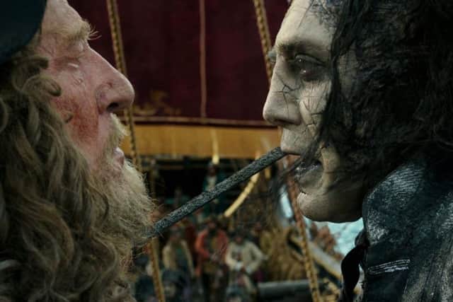 The villainous Captain Salazar (Javier Bardem) faces Barbossa (Geoffrey Rush).
