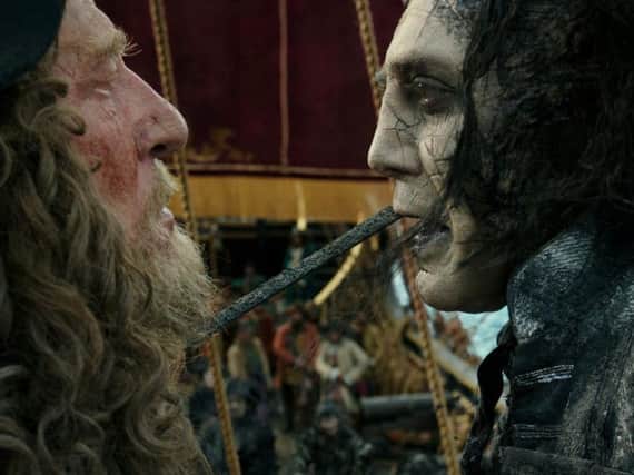 The villainous Captain Salazar (Javier Bardem) faces Barbossa (Geoffrey Rush).