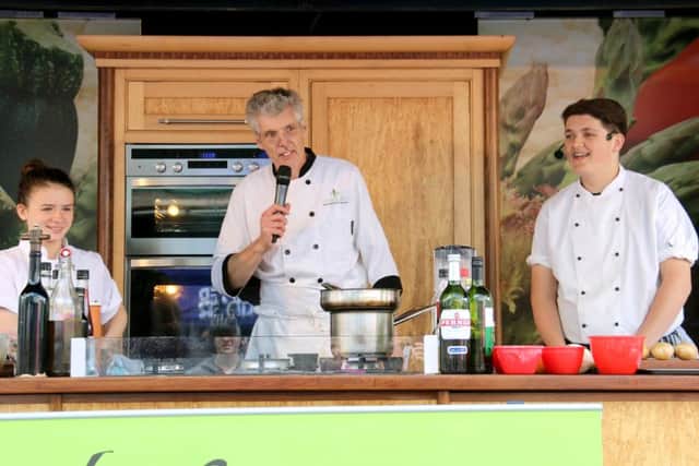 Izabella Darmin, from Havant, with chef David Griffin-Shepherd and runner-up Jonny Smith, from Gosport, at a food demonstration following their Rotary competition success