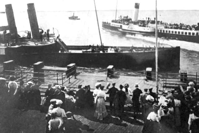 Some years before the First World War and everybody is in their Sunday best waiting for ferries on Clarence Pier, Southsea.