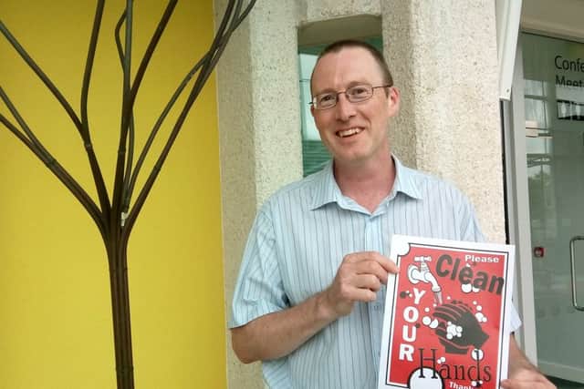 Paul Currie with his winning entry to the Clean Your Hands competition