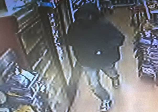 CCTV of a man in connection with a knifepoint robbery of Elly's Wine Store, on St Nicholas Avenue, in Gosport, on May 22 at 9.35pm