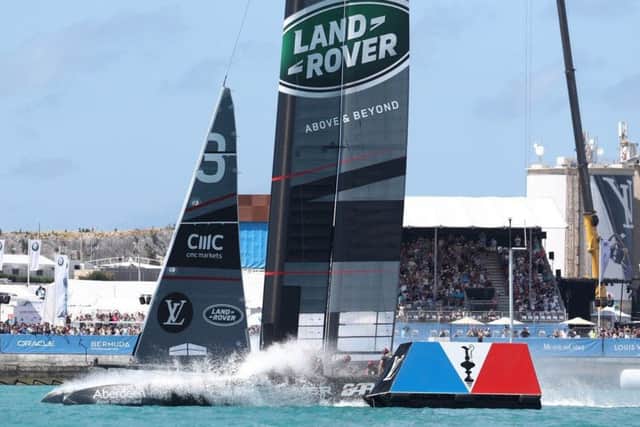 Land Rover BAR pass the finishing line in their victory against team Artemis.  Photo Credit: Gilles Martin-Raget/ America's Cup