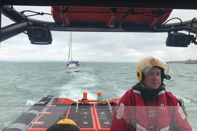 Gafirs senior helm Brian Pack towing a 28ft stricken yacht to safety after it lost power in the Solent. Picture: Gafirs.