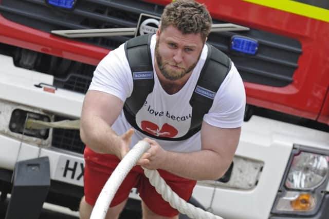 Strongman Jacob Fast takes the strain    
Picture Ian Hargreaves  (170625-1)