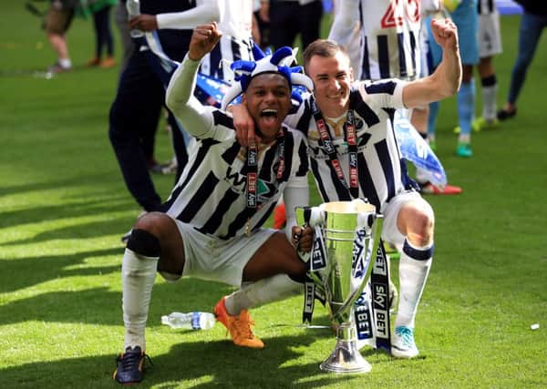 Millwall's (left-right) Mahlon Romeo and Jed Wallace celebrate winning at Wembley
