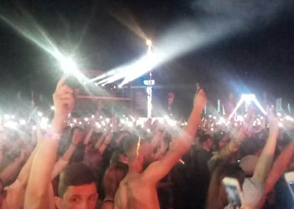 15,000 fans at Mutiny festival hold phones and lighters aloft in a gesture of solidarity with the city of Manchester
