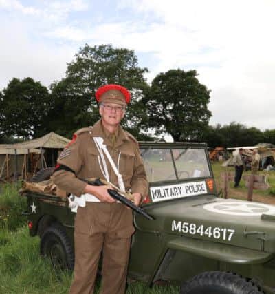 27/5/17Job 3 : 170694-CATCH LINE: Overlord The Lawns Denmead THE sounds and spectacle of military histroy will come alive as a military vehicle show returns to Denmead. The show, organised by the Solent Overlord Executive Military Collectors Club, will take place on May 27, 28 and 28 at The Lawns. John Whiting, from the club said: Ã¢Â¬ÃœThe show depicts the history of the miltary from World War One onwards with both vehicles and re-enactors in exciting arena action backed by fascinating static displays. Colin Taylor next to a military police vehicle.Photography by Habibur Rahman PPP-170528-023619006