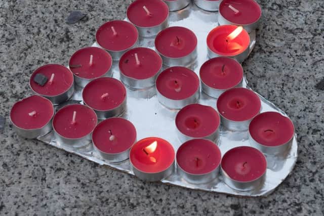A vigil was held for the victims of the Manchester bombing on the steps of Portsmouth Guildhall and tributes laid to the 22 killed
Picture: Keith Woodland (170679-027)