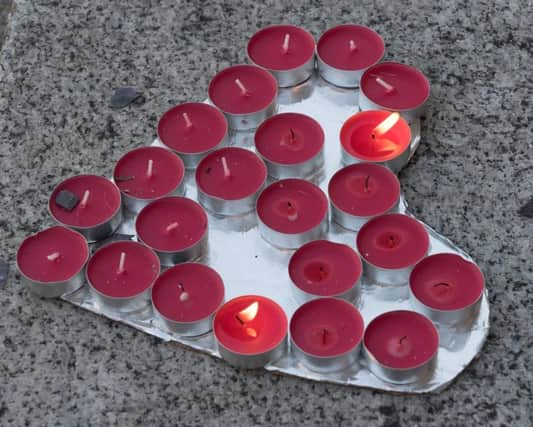A vigil was held for the victims of the Manchester bombing on the steps of Portsmouth Guildhall and tributes laid to the 22 killed
Picture: Keith Woodland (170679-027)