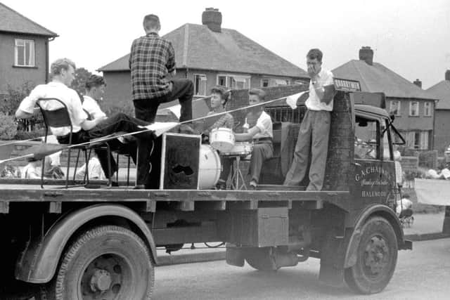 July 6, 1957. John Lennon in check shirt singing, Rod Davis on the right leaning on the lorrys roof and Pete Shotton on the left in white shirt sitting  with his back to camera. (Rod Davis collection).