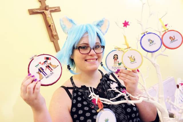 Emii McGrath (24) - with a few of her pieces of cross-stitch work at St Games Day
Picture by: Malcolm Wells (170601-5557)
P