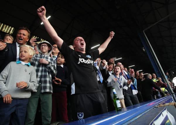 Paul Cook celebrates the League Two title with Pompey. Picture: Joe Pepler