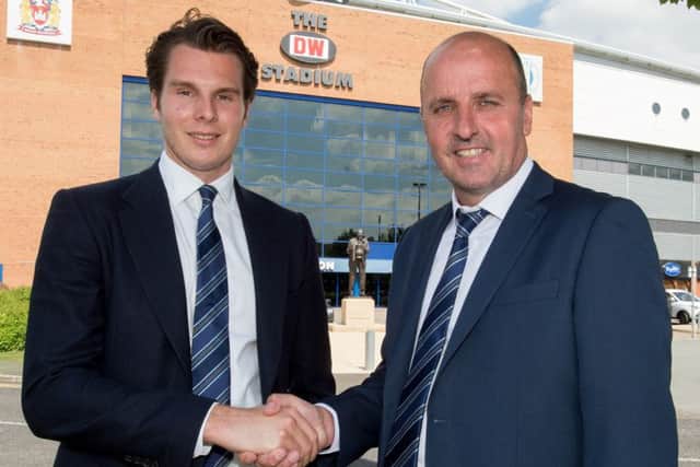 Paul Cook, right, is welcomed to Wigan Athletic by Latics chairman David Sharpe