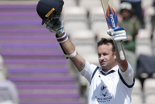 Sean Ervine celebrates his double century Picture: Barry Zee