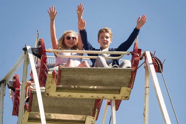 HMS Collingwood Open day and Field Gun Competition. - "riders on the ferris wheel". PPP-170406-164338001