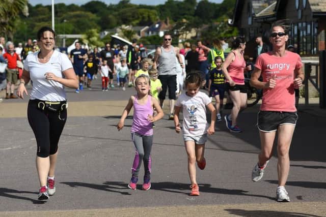 Runners received great support from family and friends in the Stokes Bay junior parkrun. Picture: Neil Marshall