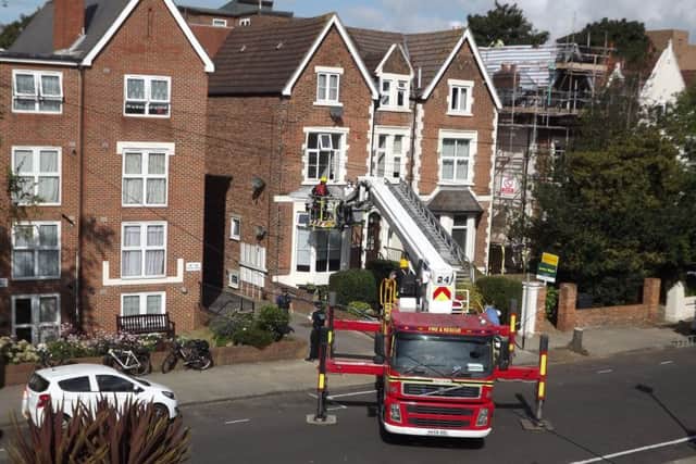 Firefighters at the scene of the death in Outram Road, Southsea